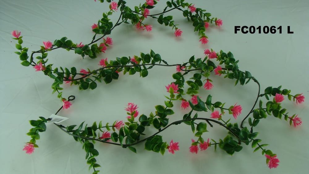 Guía de plástico con follaje y flores L